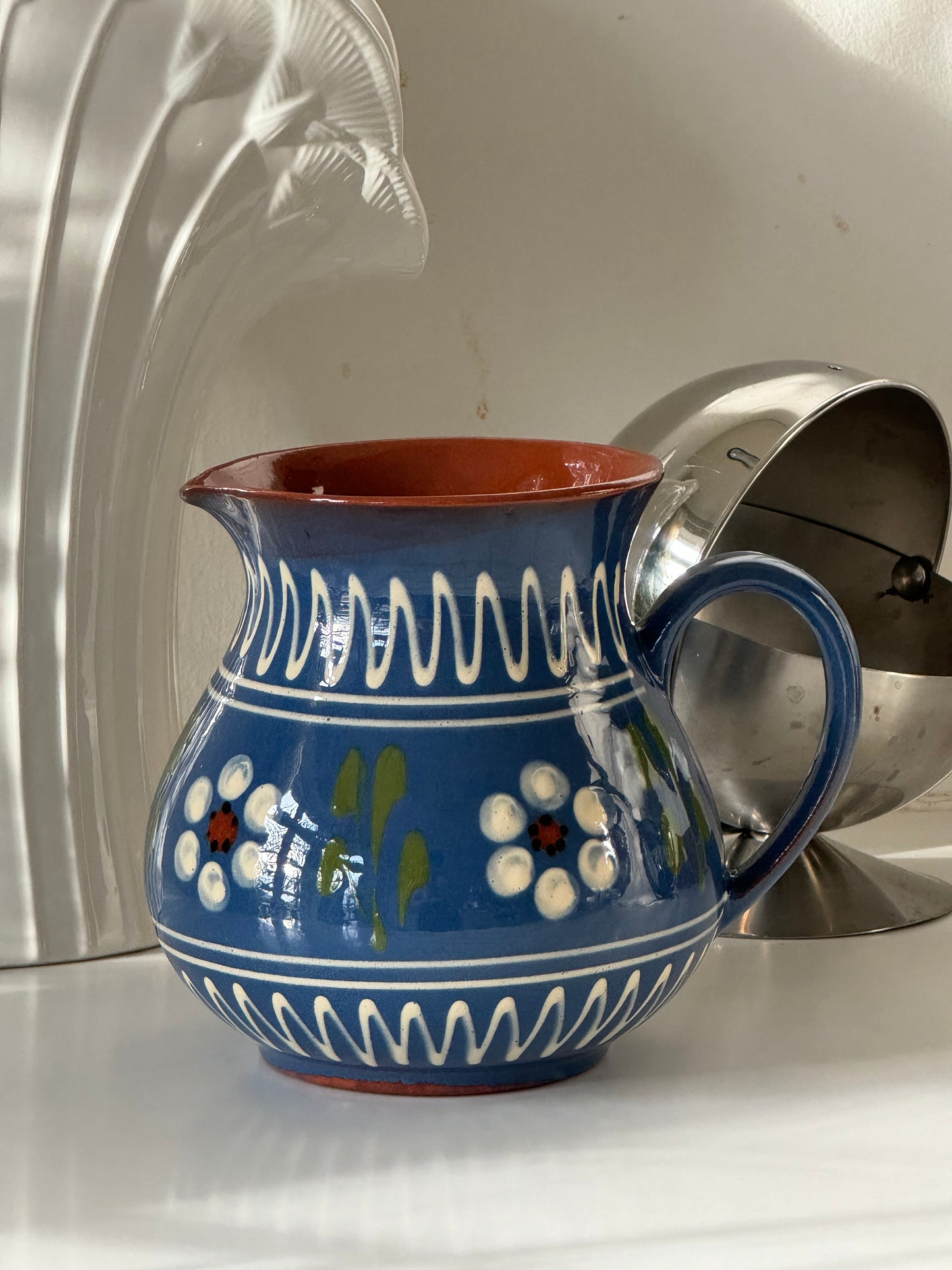 Blue ceramic pitcher