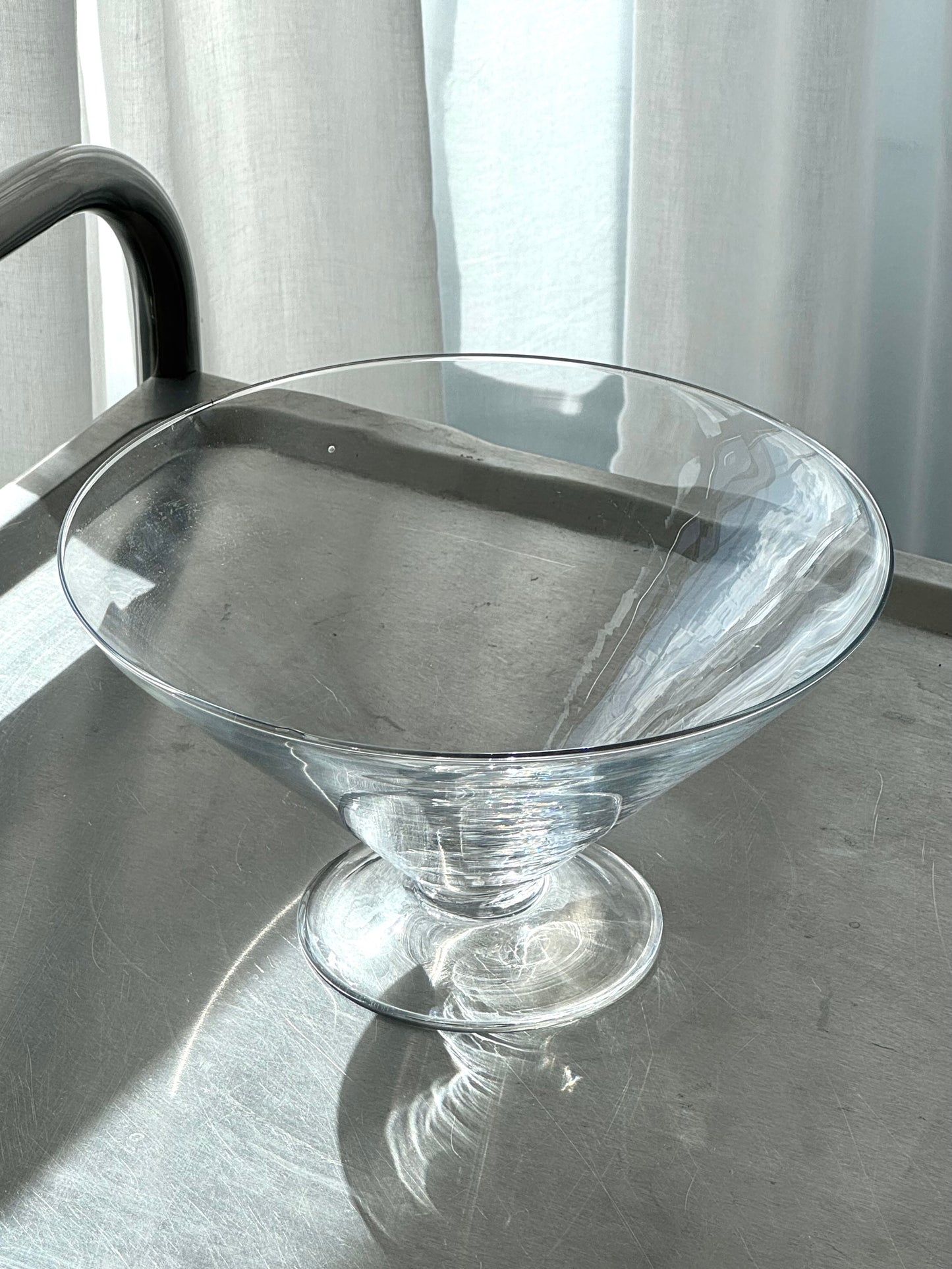 Big glass bowl on foot