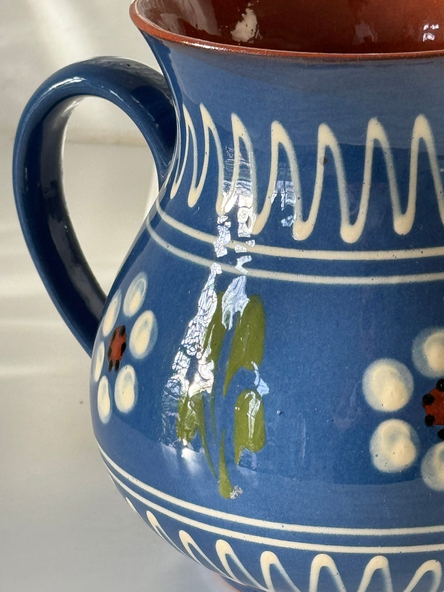 Blue ceramic pitcher
