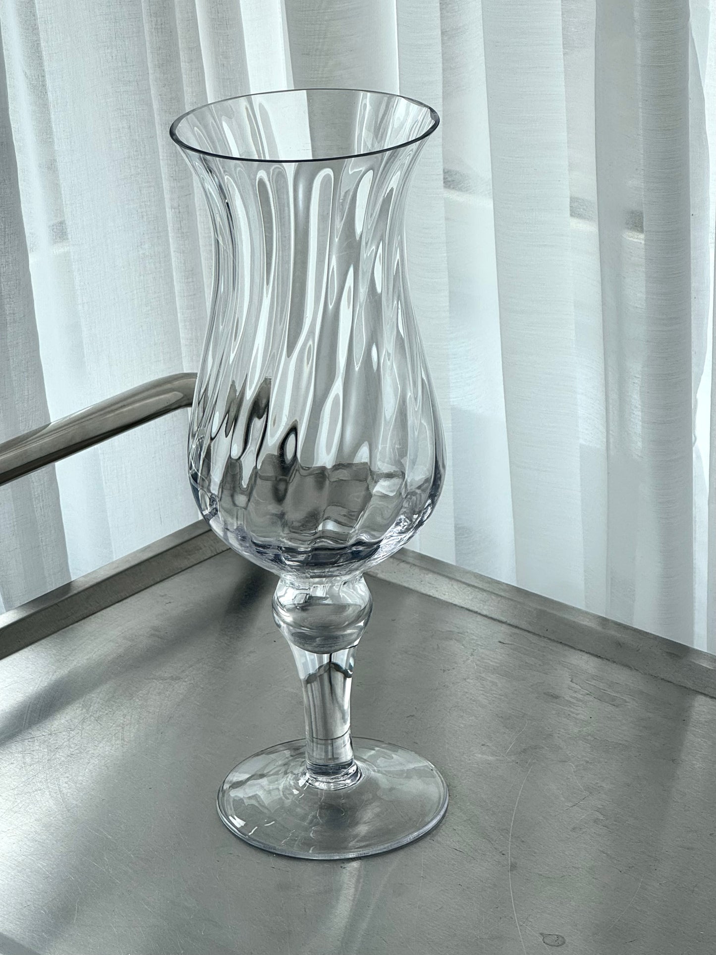 Swirling vase on foot