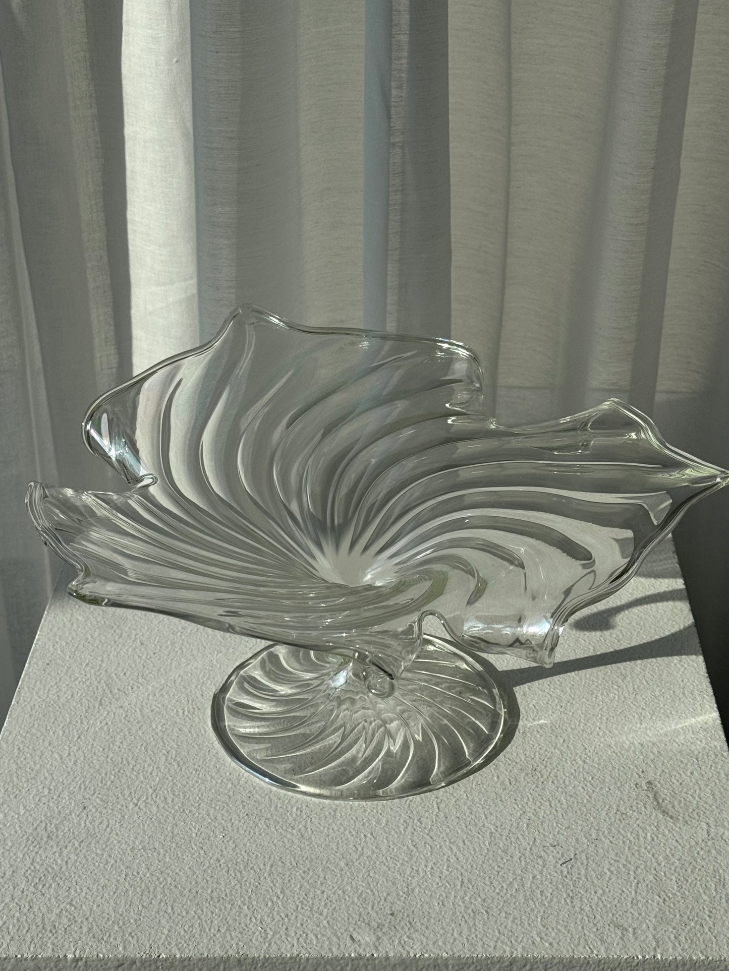 Swirling glass stand