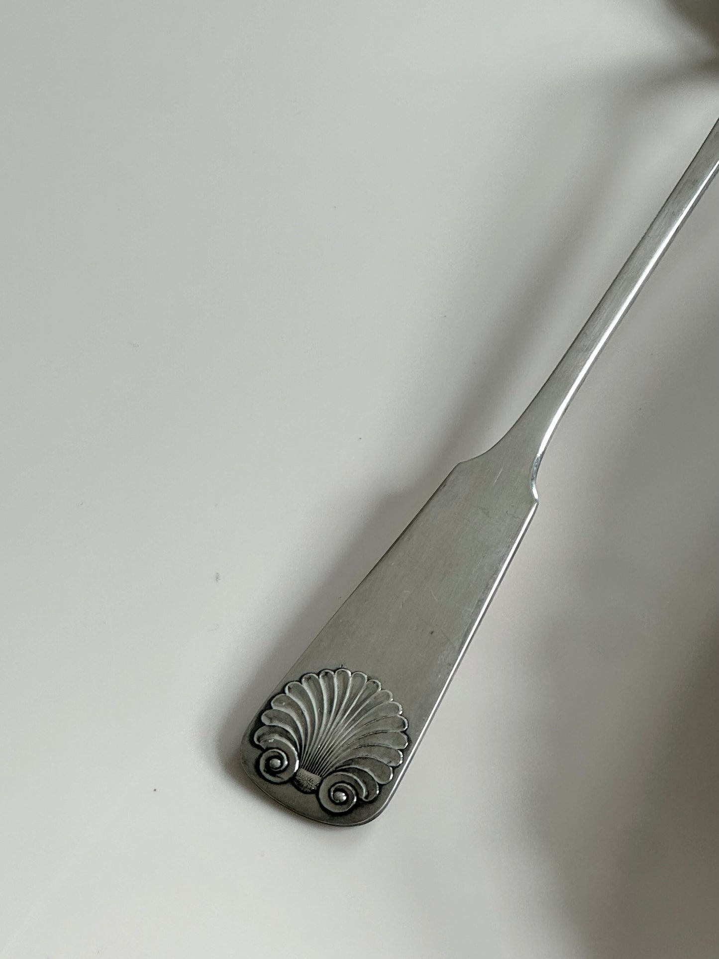 Silver pleated serving spoon