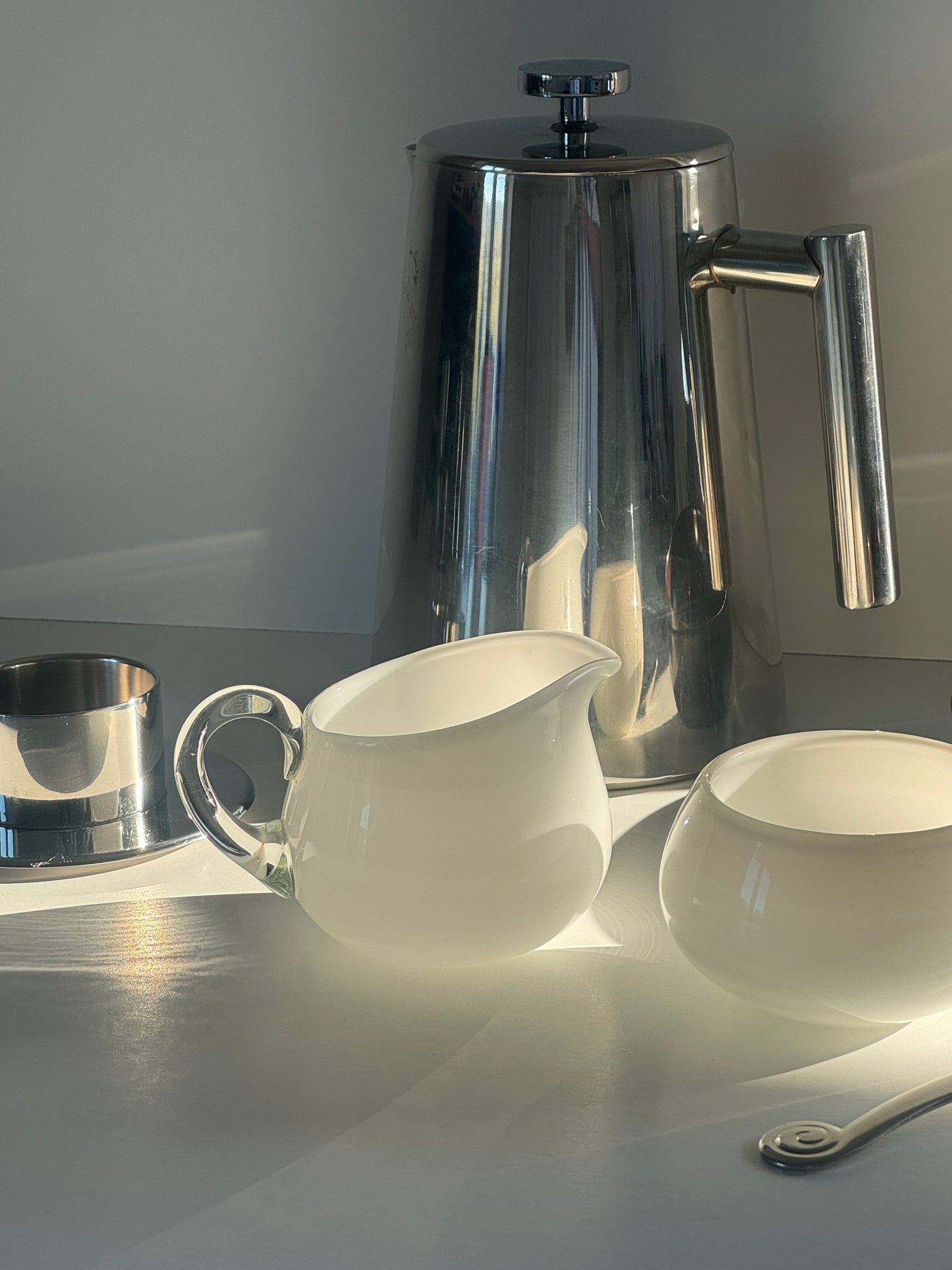 Glass milk jug and sugar bowl
