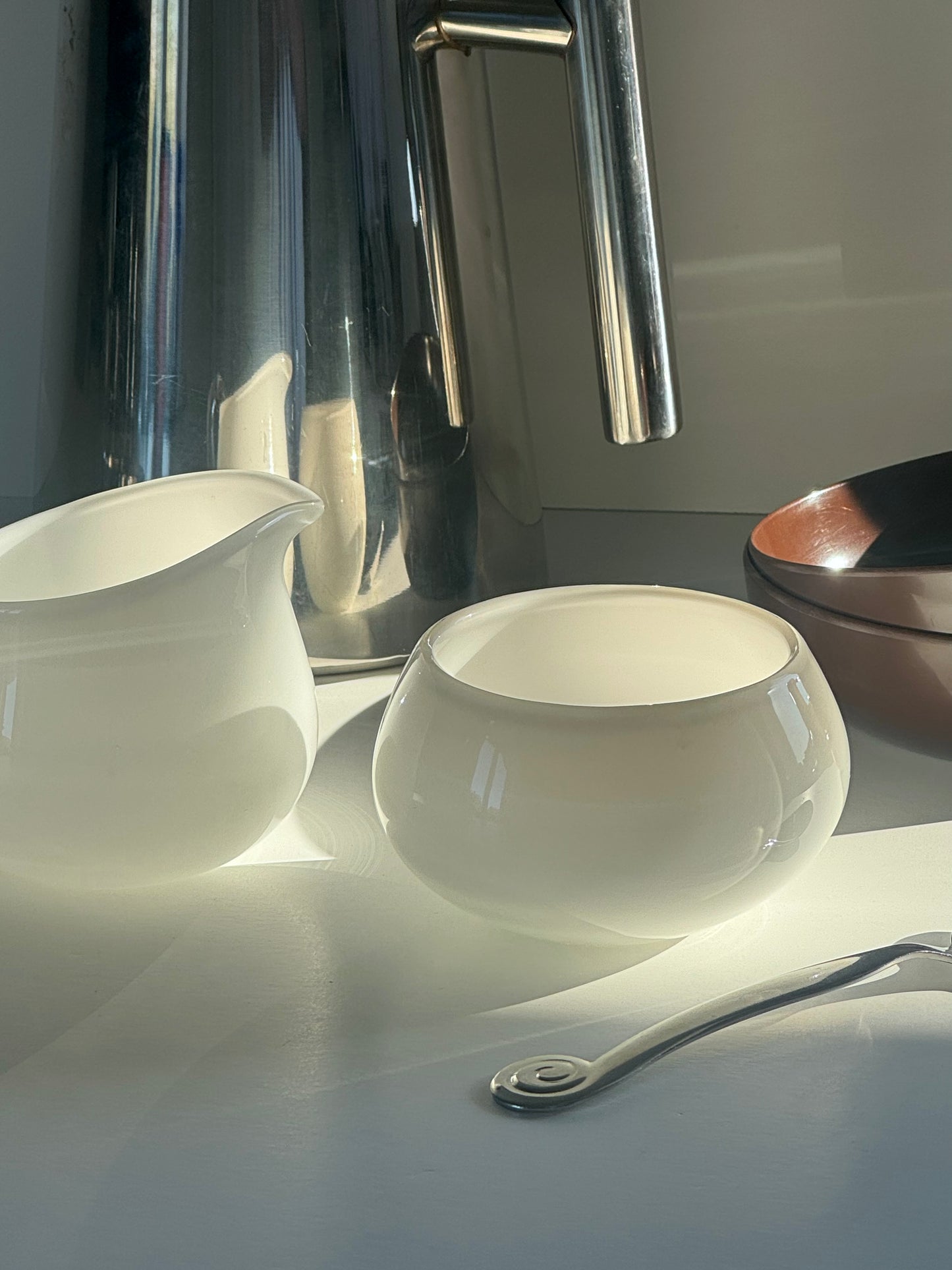 Glass milk jug and sugar bowl