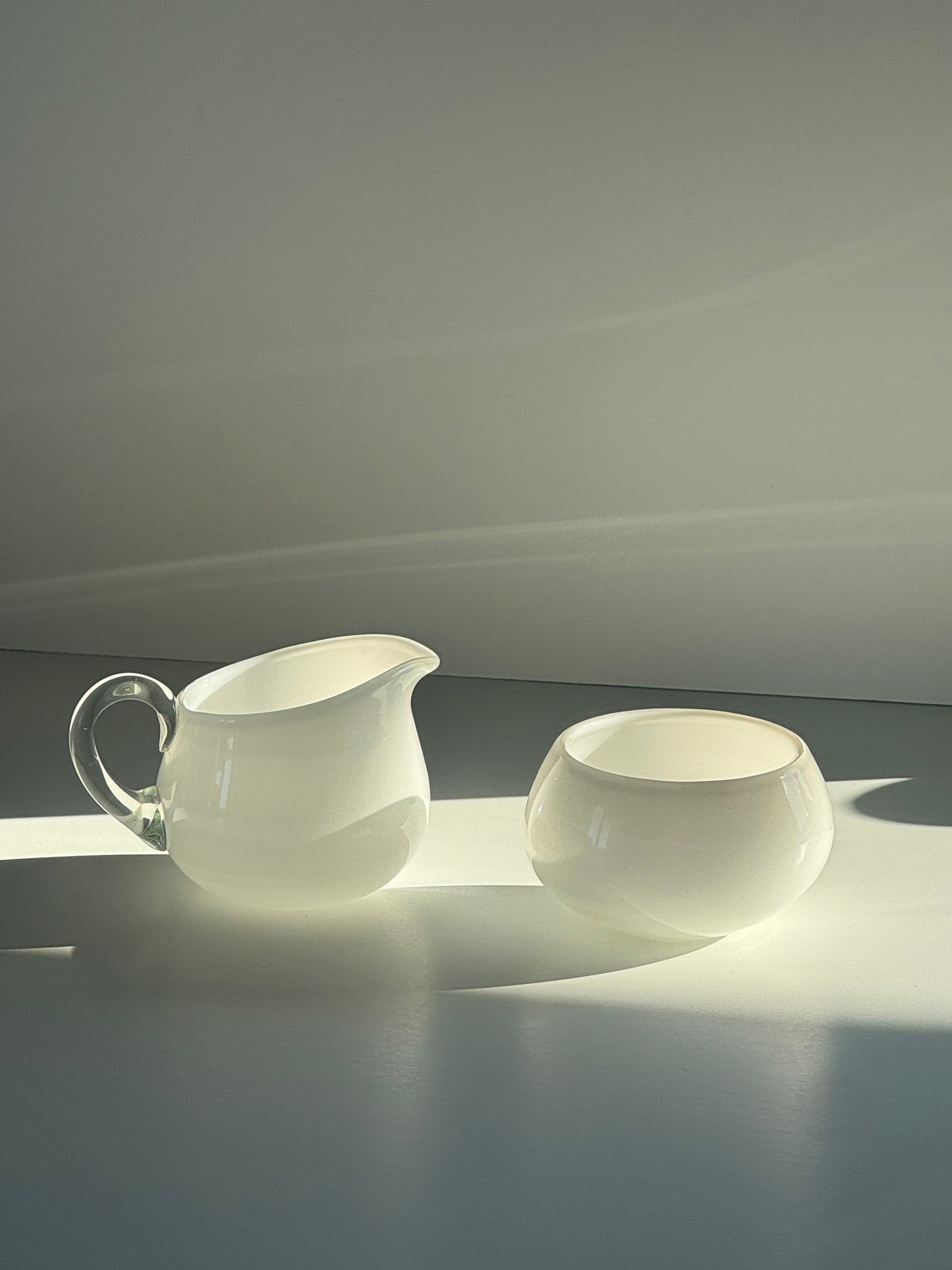 Glass milk jug and sugar bowl