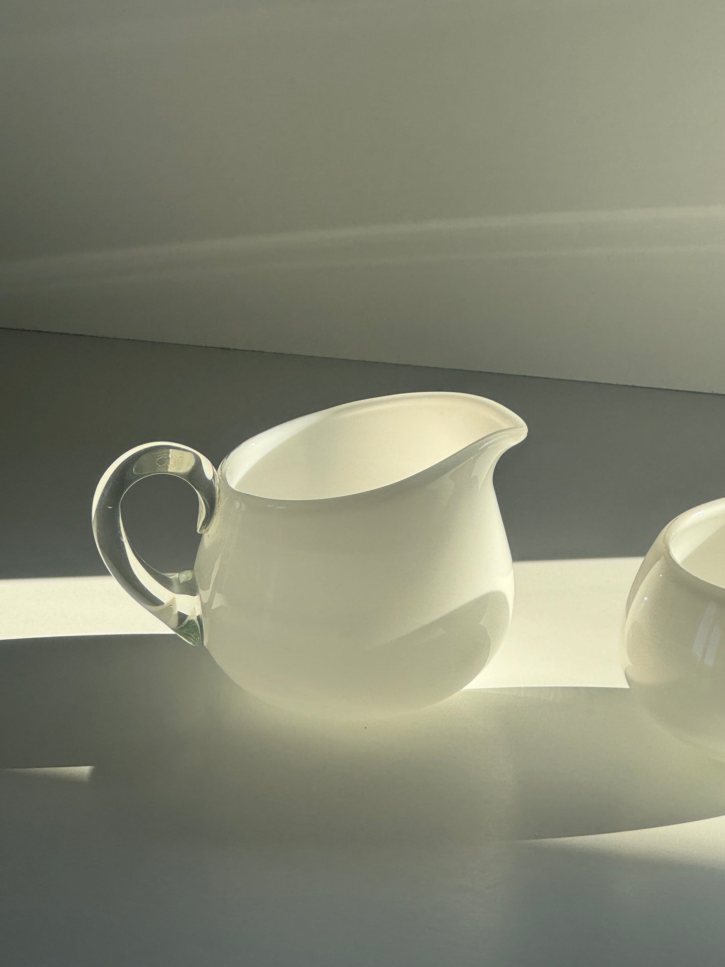Glass milk jug and sugar bowl