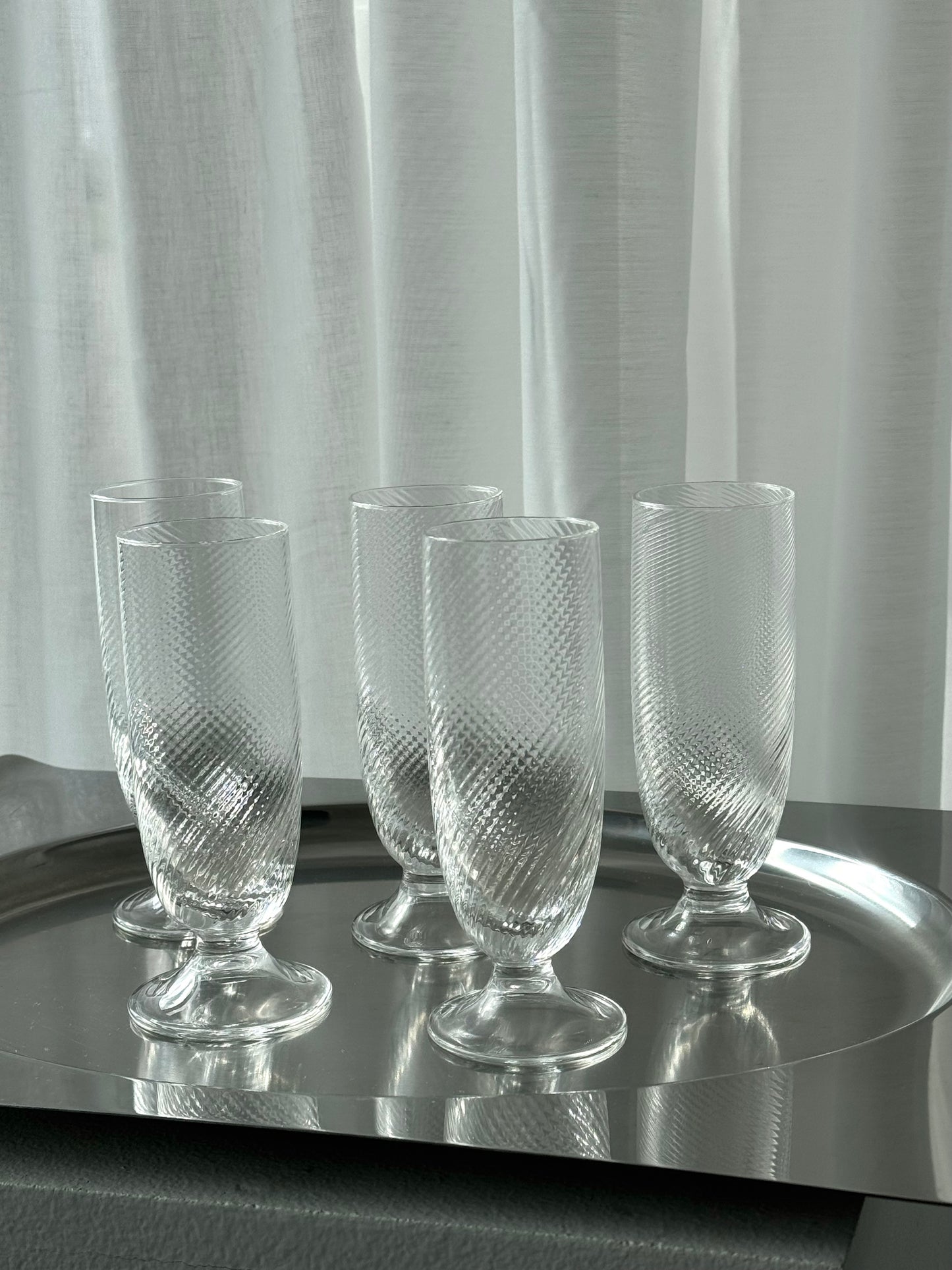 Swirling tall glasses