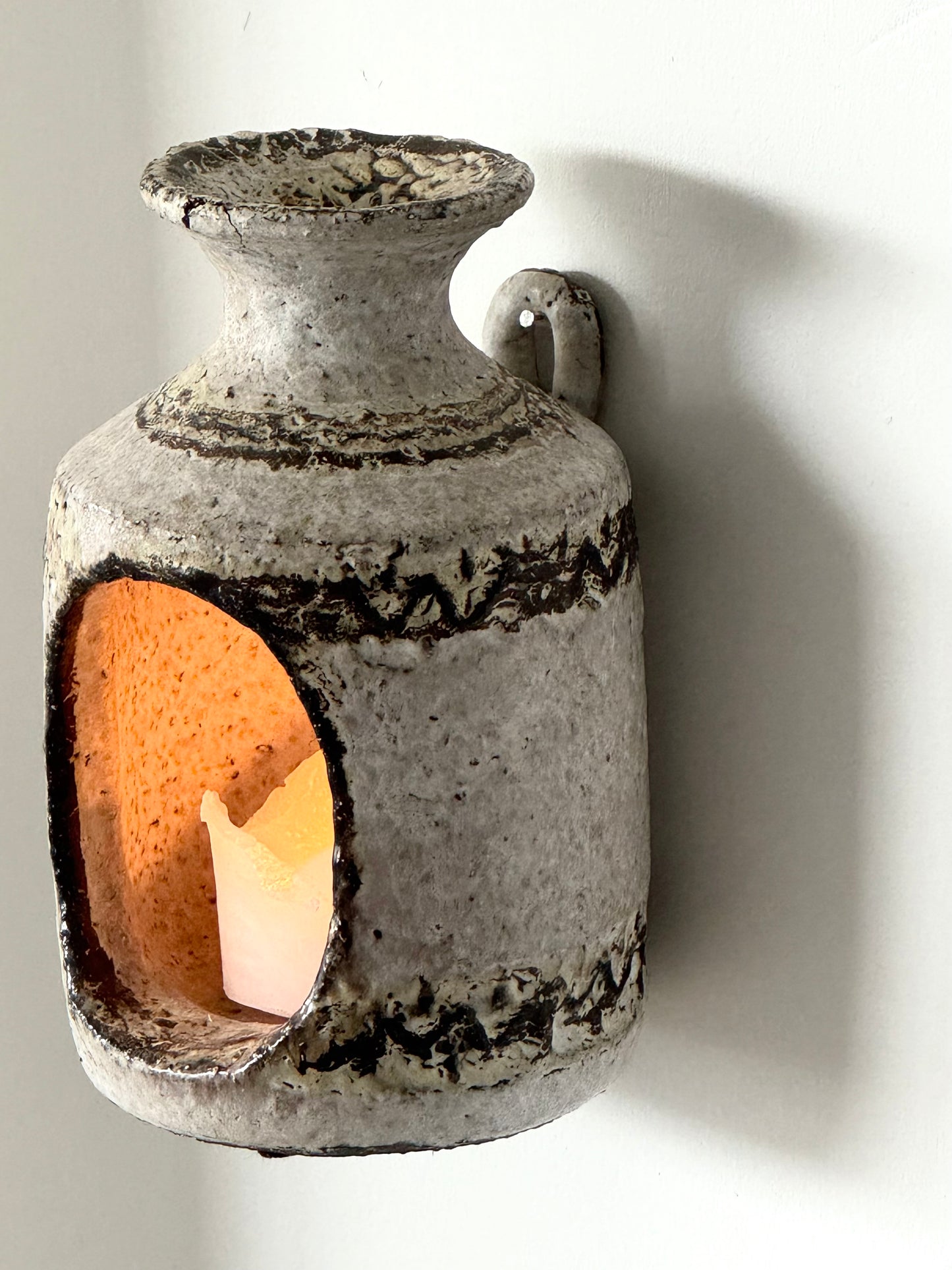 Wall hung candleholder