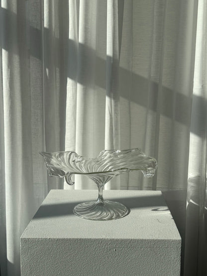 Swirling glass stand