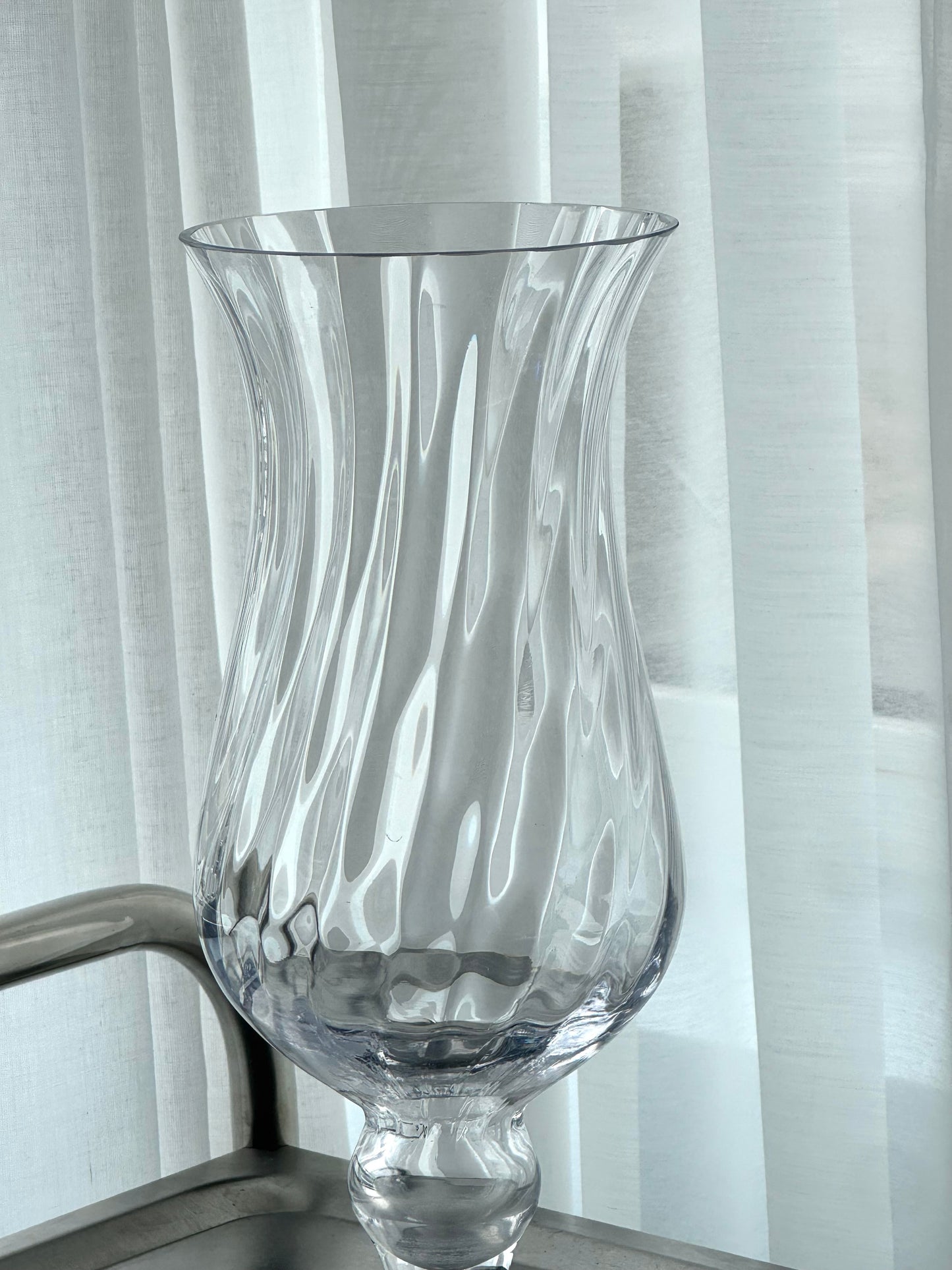 Swirling vase on foot