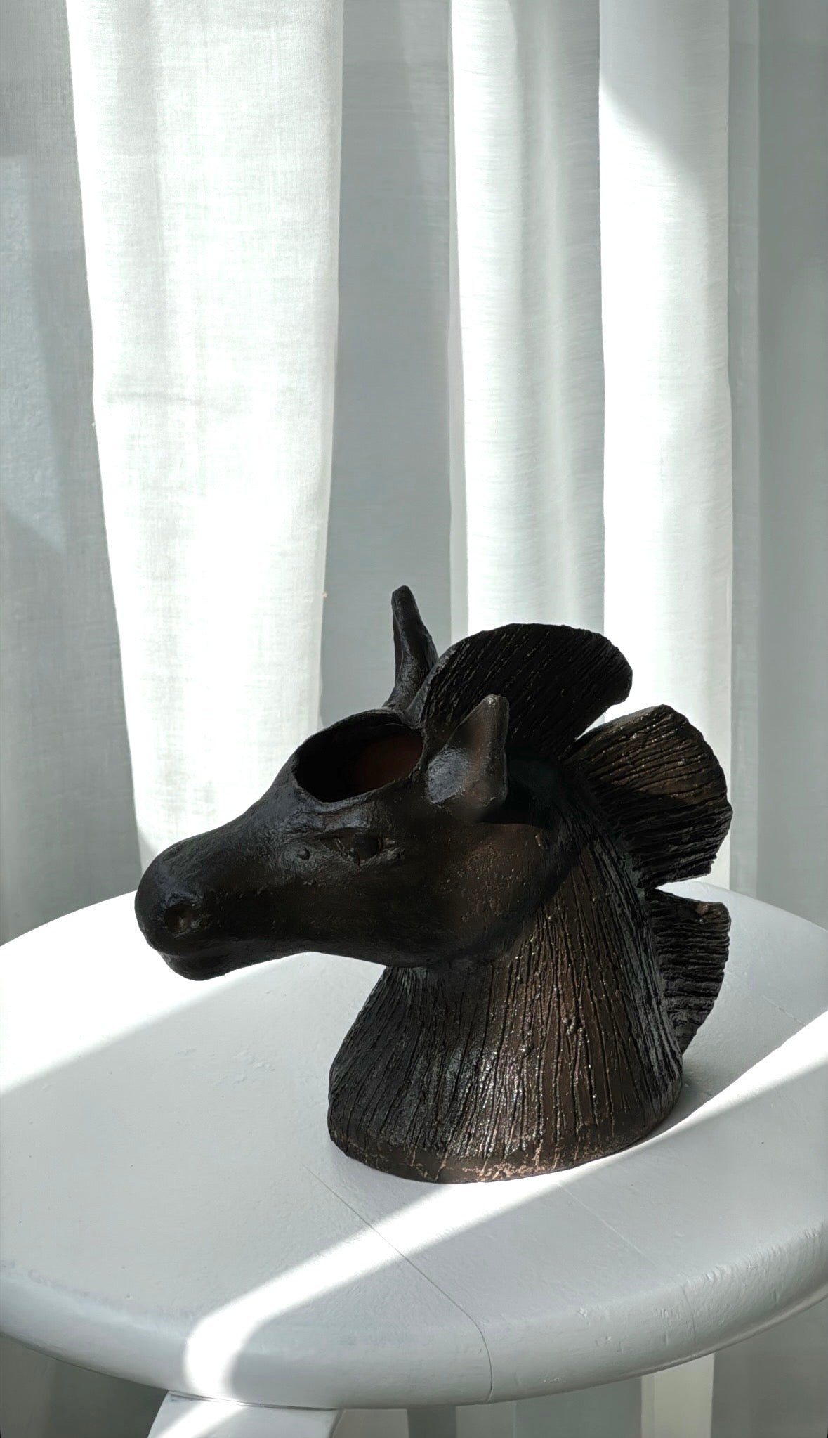 Horse head vase