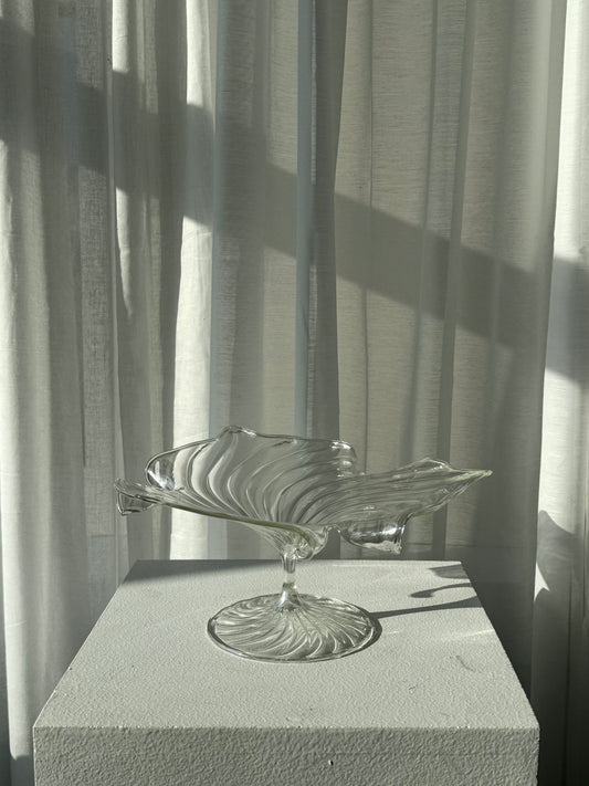 Swirling glass stand