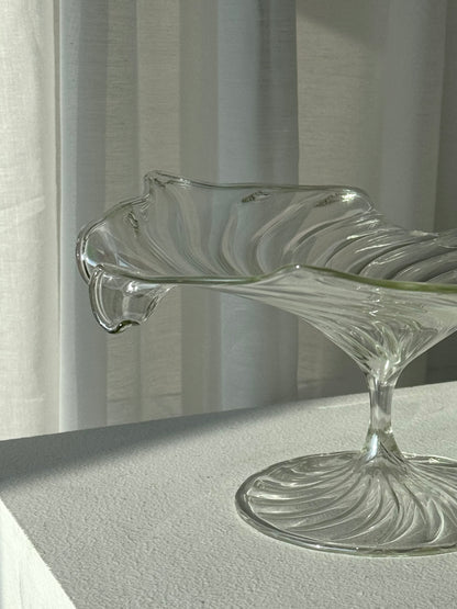 Swirling glass stand