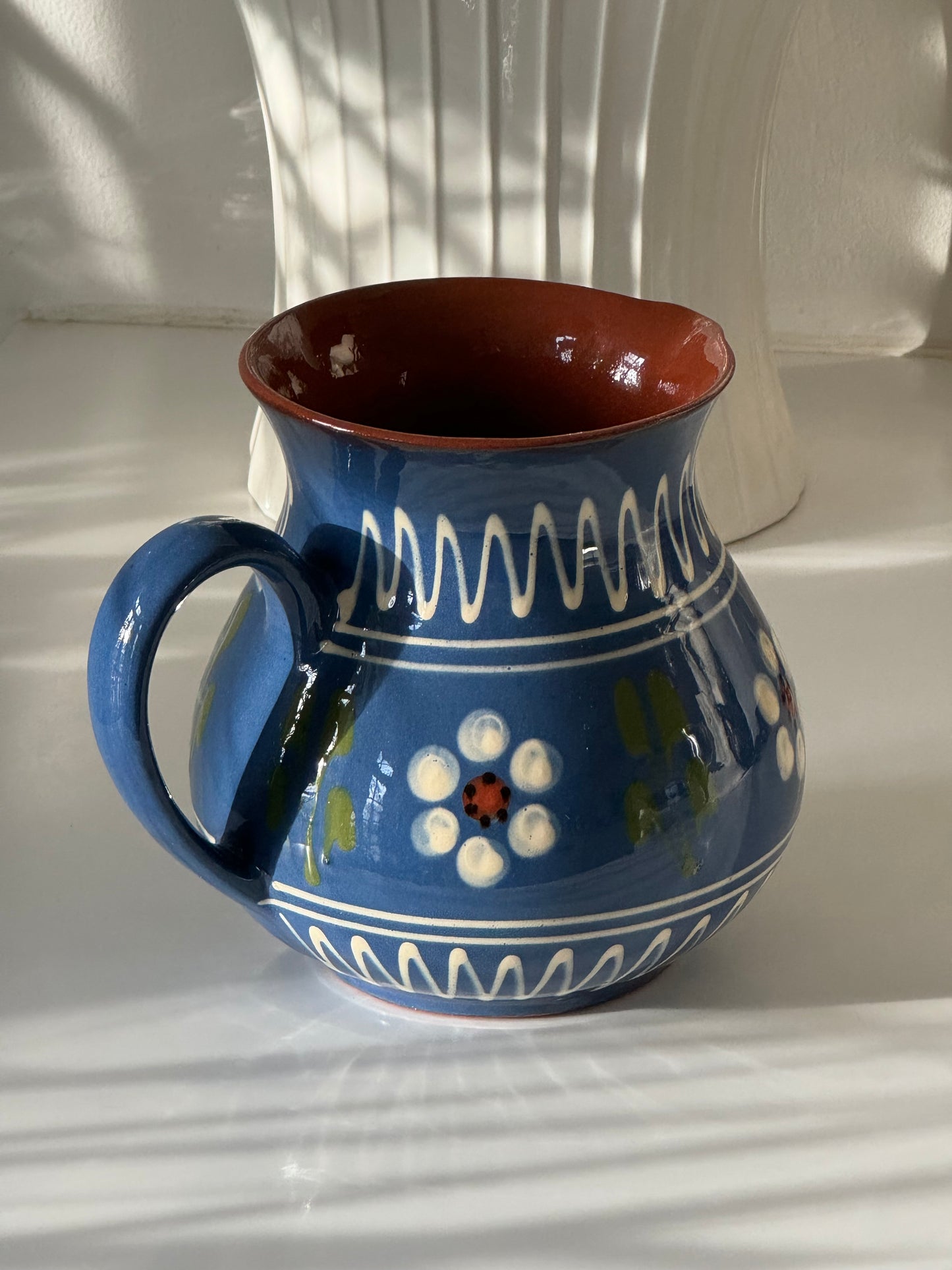Blue ceramic pitcher