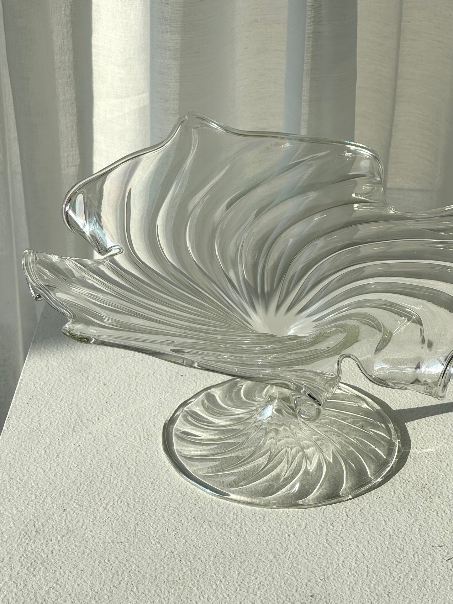 Swirling glass stand