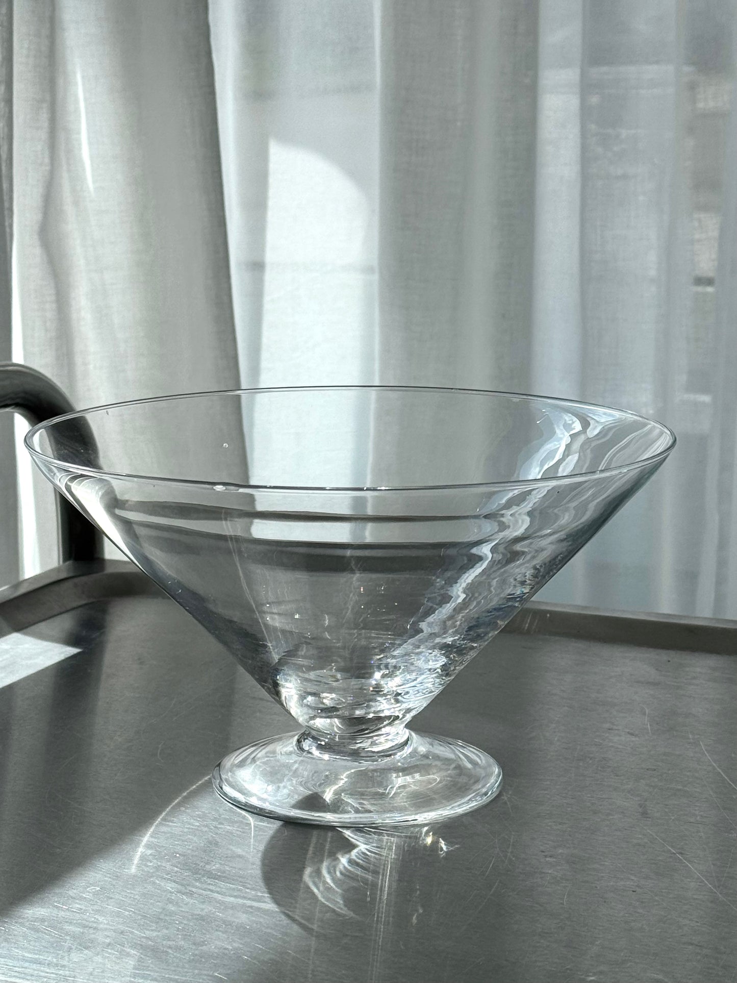 Big glass bowl on foot