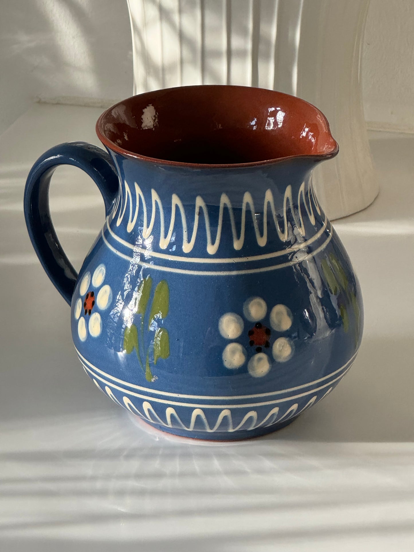 Blue ceramic pitcher