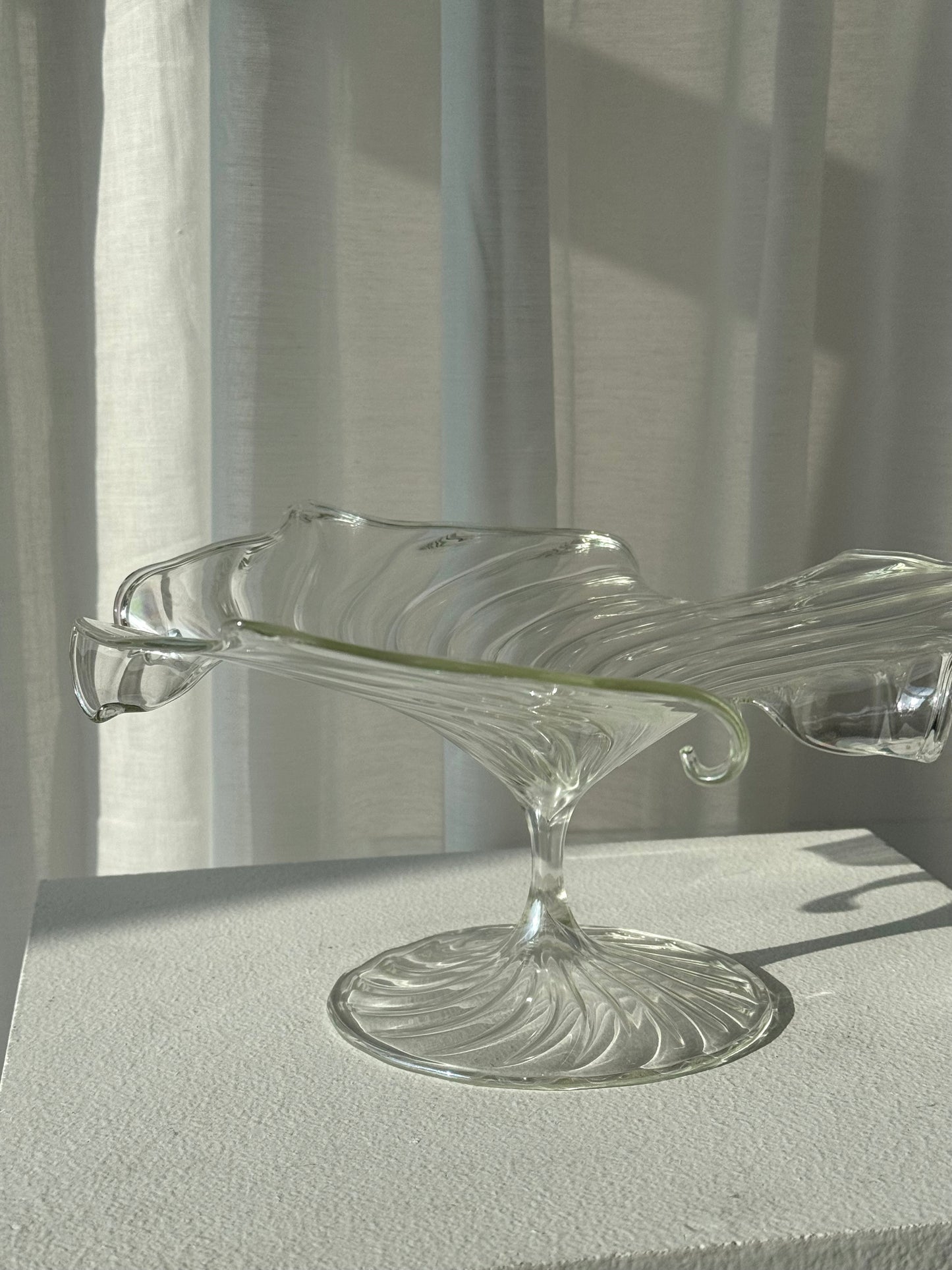 Swirling glass stand