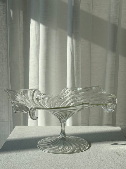 Swirling glass stand