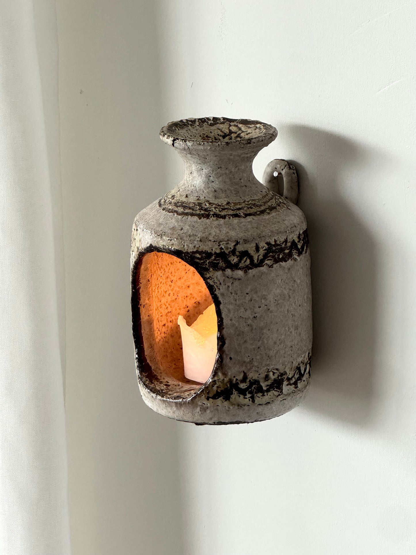 Wall hung candleholder