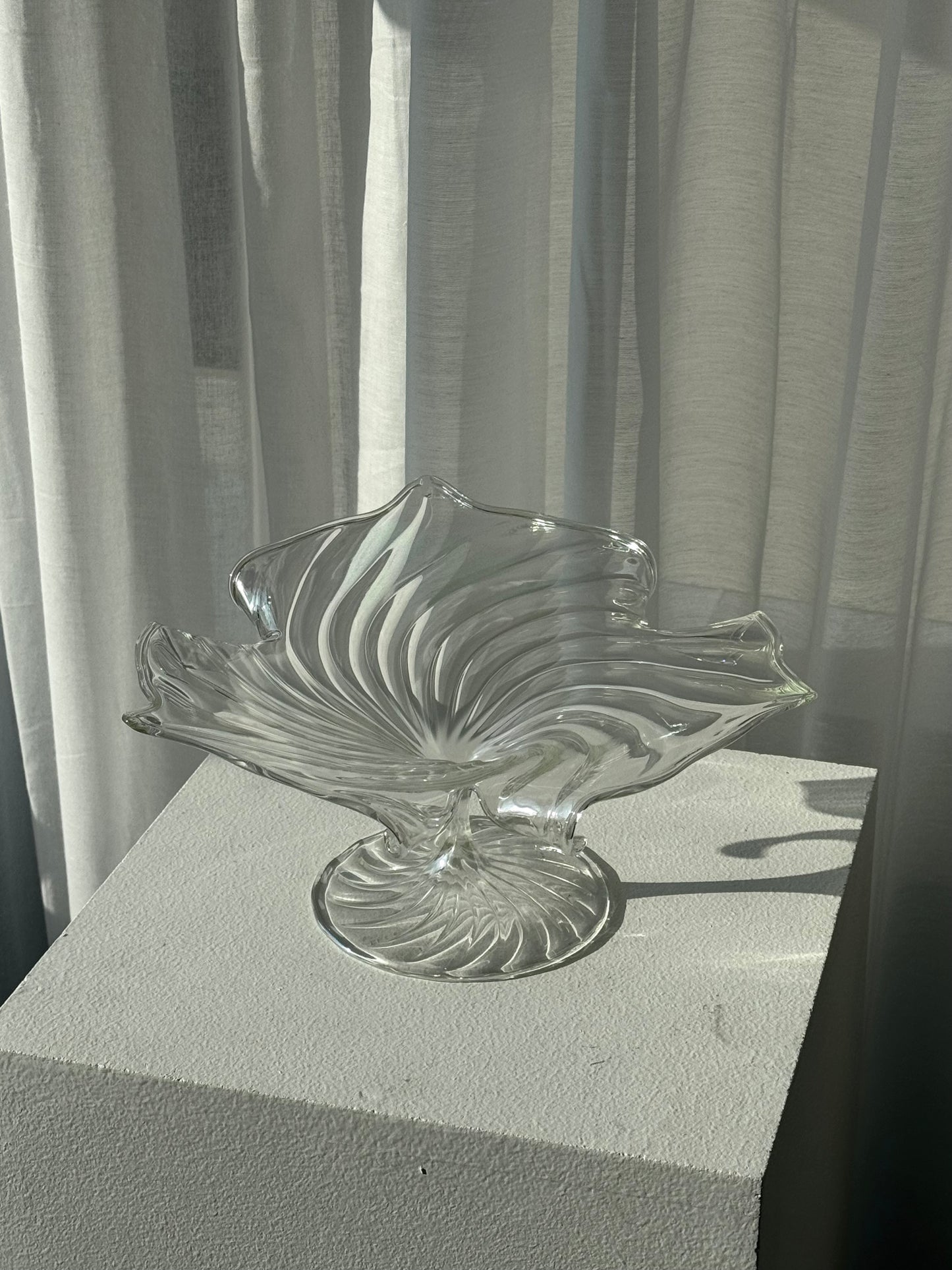 Swirling glass stand
