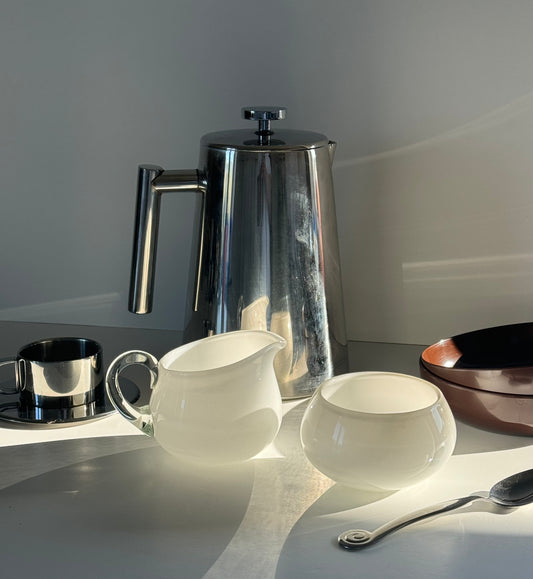Glass milk jug and sugar bowl