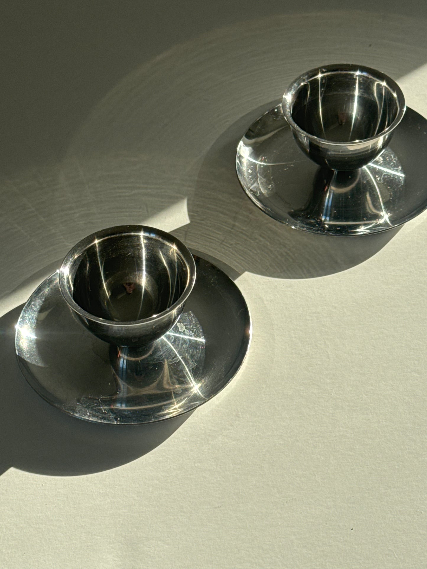 Steel eggcups on foot