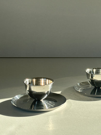 Steel eggcups on foot