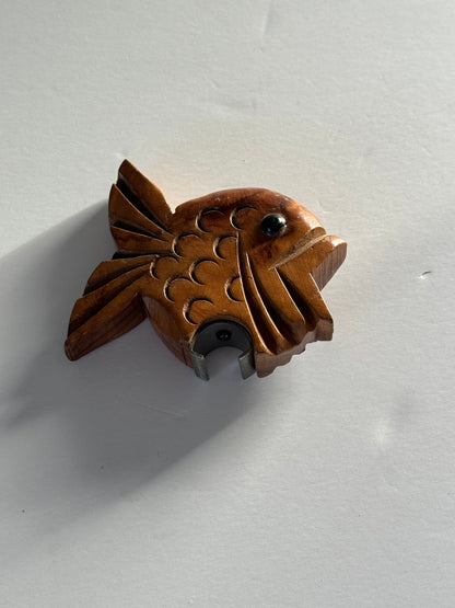 Wooden fish bottle opener.