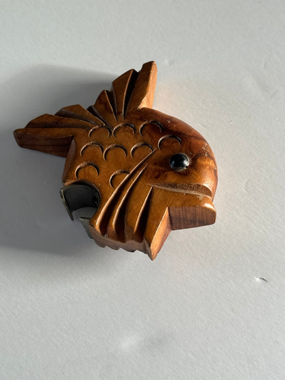 Wooden fish bottle opener.