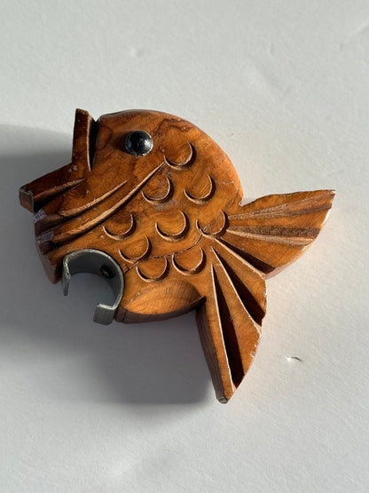 Wooden fish bottle opener.